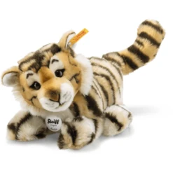 STEIFF Radjah Baby-Schlenker Tijger, 28 Cm, Liggend -EXIT TOYS || Steiff || fehn Verkoopwinkel steiff radjah baby schlenker tijger 28 cm liggend a079250 3
